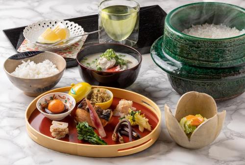 a plate of food on a table with rice at 祇園の宿 杏花 in Kyoto