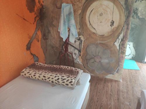 a corner of a room with a wall with a shelf at The Begnas sound healing center in Deorāli