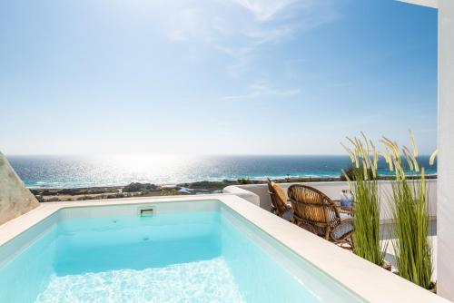 a swimming pool with a view of the ocean at Suites Las Vistas by Menorca Vacations in Son Bou