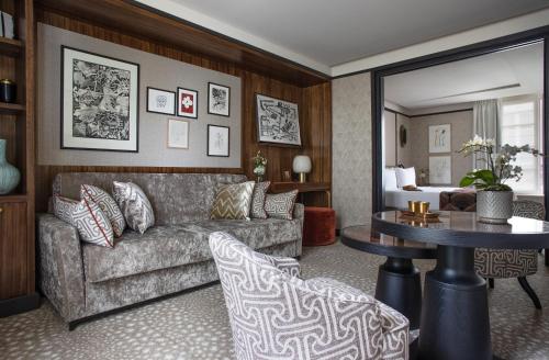 a living room with a couch and a table at Esprit Saint Germain in Paris