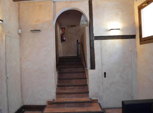 a stairway leading up to a building with a door at Casa Palacio de los Sitios in Zaragoza