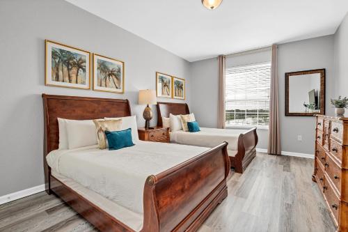 a bedroom with two beds and a window at 4816 Cayview Ave #306 in Orlando