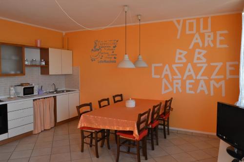 a kitchen with a table and chairs in a room at B&B Casazze Dream in Marcaria