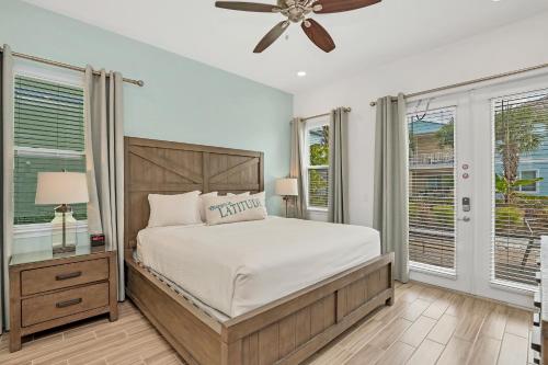 a bedroom with a bed and a ceiling fan at Gorgeous Margaritaville Cottage wPrivate Patio in Orlando
