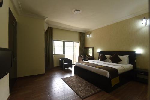 Ένα ή περισσότερα κρεβάτια σε δωμάτιο στο Anabel Apartment and Suites, Abuja