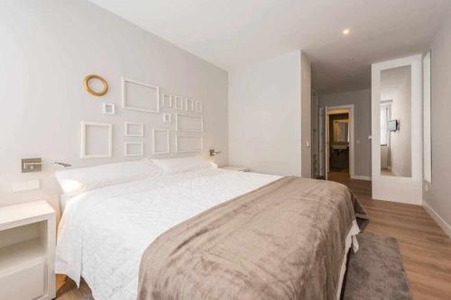 Ένα ή περισσότερα κρεβάτια σε δωμάτιο στο Apartamento lujo princesa gran vía