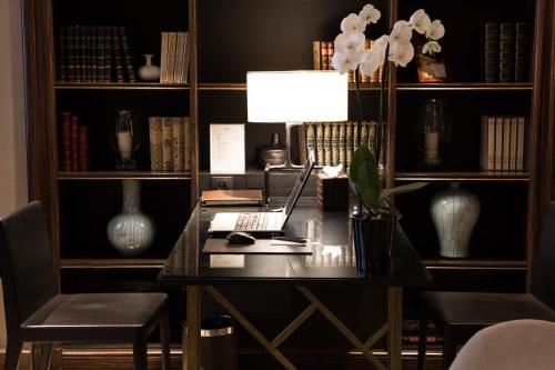 an office with a desk with a laptop on it at Esprit Saint Germain in Paris