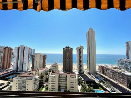 a view of a city with tall buildings and the ocean at Mediterraneo 43 - Aloturin Benidorm in Benidorm