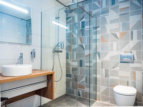 Een badkamer bij Fletcher Hotel-Restaurant Scheveningen