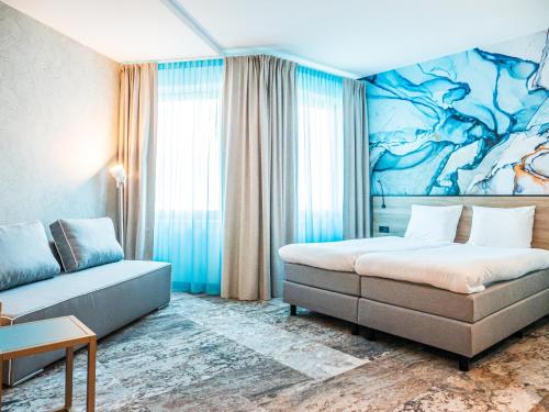 Кровать или кровати в номере Fletcher Hotel-Restaurant Scheveningen
