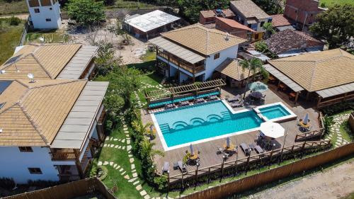 an aerial view of a house with a swimming pool at Carapitangui Pousada in Barra Grande