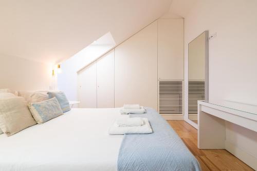 En eller flere senge i et værelse på Amazing Rooftop at City Center