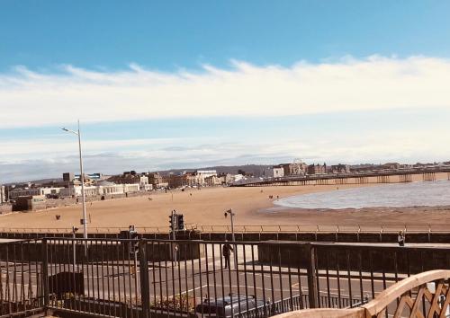 a view of a beach with people on it at Pavilion Holiday Apartments in Weston-super-Mare