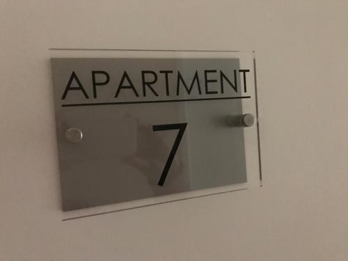 a sign that says apartment on a door at Pavilion Holiday Apartments in Weston-super-Mare