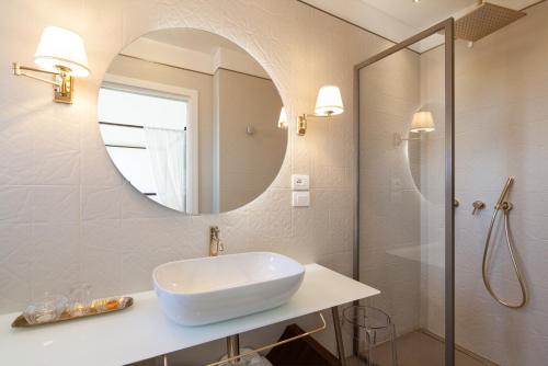 a bathroom with a sink and a mirror at Villa Francesca Relais in Gradara