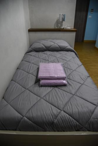 Una cama o camas en una habitación de Margherita 2.0