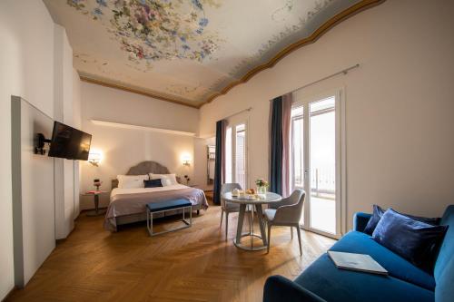 Postel nebo postele na pokoji v ubytování Hotel Touring