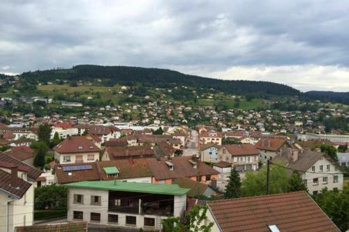 a view of a town with houses and buildings at Appartement spacieux Gérardmer 90 m² in Gérardmer