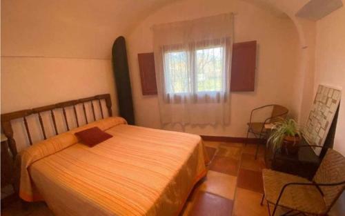 Ένα ή περισσότερα κρεβάτια σε δωμάτιο στο Ca lEsperrucat Acogedora casa de pueblo Tranquila y bien comunicada