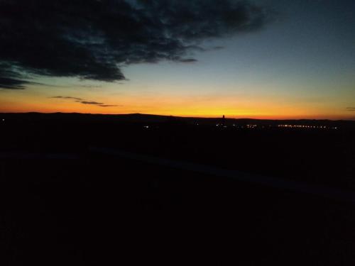 a sunset with the sky in the background at Campo de los Zorros in Nono