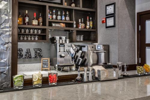 a bar with a counter with a coffee maker at Hyatt Place Fort Worth/Hurst in Hurst