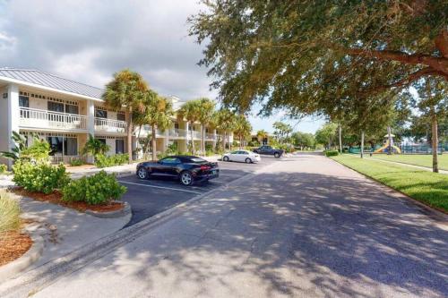 a street with cars parked in front of a building at Little Harbor Resort #114 Tampa Bay FL Beach, Bayside & 2 Pools in Ruskin