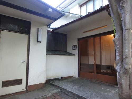 an outside view of a building with a door at Kinreisou in Hakone