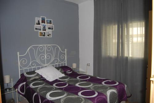En eller flere senge i et værelse på Vivienda Rural El Retorno