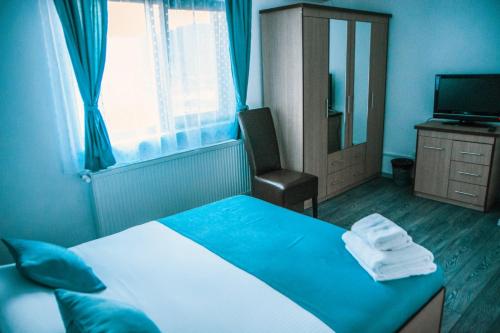 Ένα ή περισσότερα κρεβάτια σε δωμάτιο στο Casa Ducu