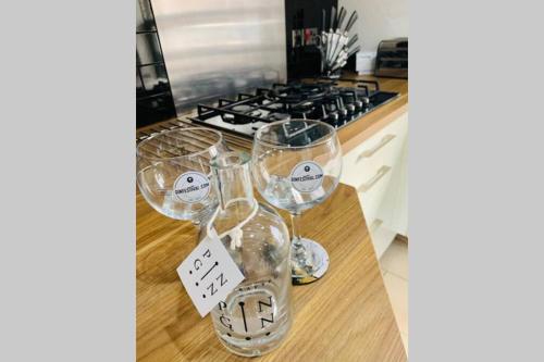 a group of wine glasses sitting on top of a counter at Boutique Townhouse Uphill Lincoln in Lincolnshire