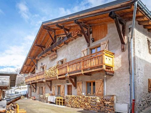 a building with wooden balconies on the side of it at Pretty Chalet with Sauna Skiing Nearby in Peisey-Nancroix