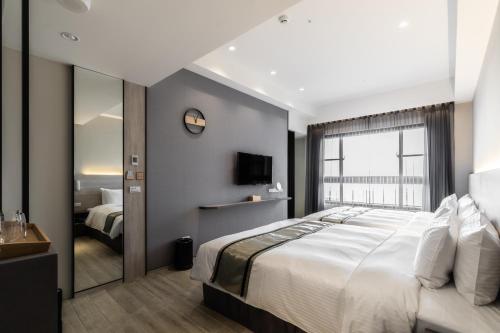 Katil atau katil-katil dalam bilik di Hotel YAM LAGOM
