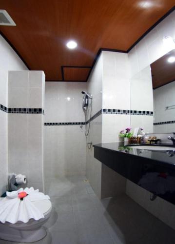 a bathroom with a toilet and a sink at Vivi Boutique Room Hotel SHA Plus in Rawai Beach