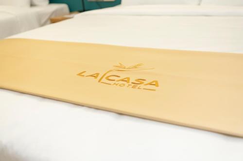 a mattress with a laas hotel logo on it at La Casa Tuy Hòa in Tuy Hoa