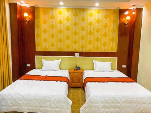 Postel nebo postele na pokoji v ubytování An Khang Hotel