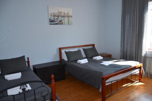 a bedroom with a bed and a couch at Borjomi Sichi in Borjomi