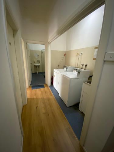 a bathroom with a sink and a toilet at Cozy little room for 1 or 2 in Sydney