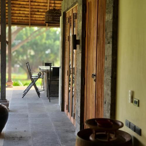 an open door to a room with a table at Tropical villa in the Bangsare hills near Pattaya in Bang Sare