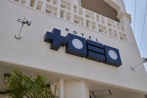 a hotel sign on the side of a building at HOTEL tuka miika in Ishigaki Island