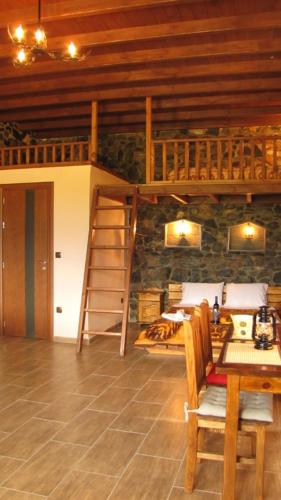 a room with two bunk beds and a table at Ihnilatis in Kerkíni