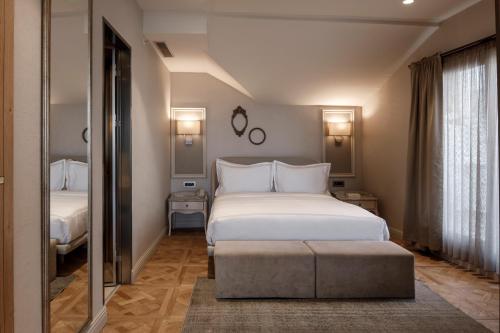 Postel nebo postele na pokoji v ubytování Lazzoni Hotel