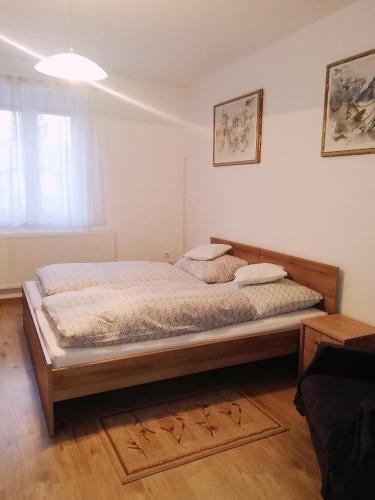 a bedroom with a large bed in a room at szt.flórián in Cserszegtomaj