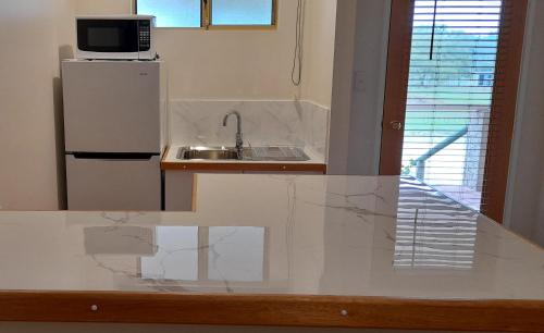 a white refrigerator freezer sitting on top of a counter at 101 Oatlands in Mount Barker