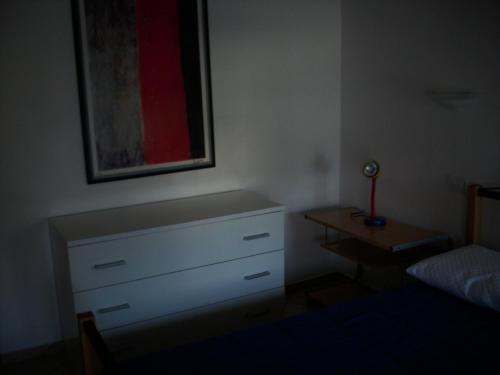 Un pat sau paturi într-o cameră la Appartamento Sonia