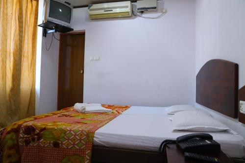 Ramanilayam Tourist Homeにあるベッド