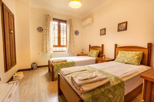 Postel nebo postele na pokoji v ubytování İznik Seyir Otel
