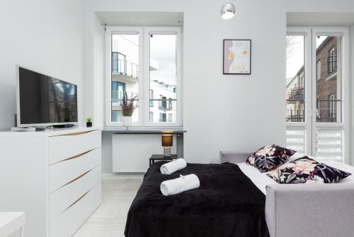 Lova arba lovos apgyvendinimo įstaigoje Stylish & Modern Apartments Praga