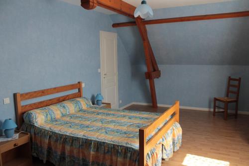Łóżko lub łóżka w pokoju w obiekcie Gite Ladagnous