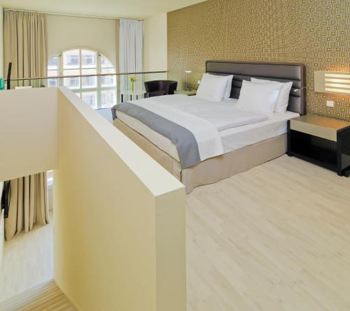 Katil atau katil-katil dalam bilik di H10 Ku'Damm Lofts
