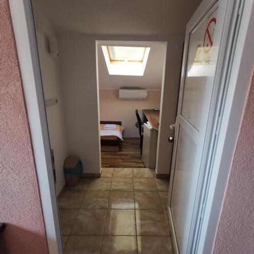 a hallway leading to a room with a ceiling at Kafana Zlatna Ribica in Golubac